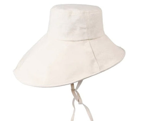 Stay cool while tending your garden with this elegant linen wide brim sun hat. Made from breathable linen, with a full face and neck coverage, perfect for sunny days among your veggies and flowers, or simply enjoying your garden. The adjustable chin strap keeps it secure on breezy afternoons, making it your ideal companion for every garden adventure." 