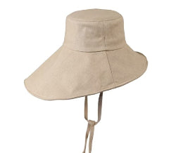 Stay cool while tending your garden with this elegant linen wide brim sun hat. Made from breathable linen, with a full face and neck coverage, perfect for sunny days among your veggies and flowers, or simply enjoying your garden. The adjustable chin strap keeps it secure on breezy afternoons, making it your ideal companion for every garden adventure.